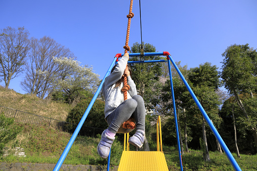 Japanese girl (5 years old) playing with flying fox