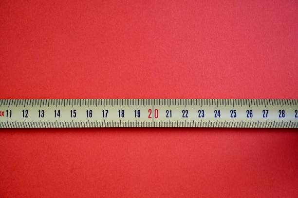 istock yellow and metallic measuring tape with black numbers 1219128693