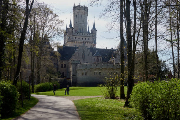 View of the park at the entrance of Marienburg Palace with the castle in the background Nordstemmen, Germany, April 15, 2020: View of the park at the entrance of Marienburg Palace with the castle in the background marienburg stock pictures, royalty-free photos & images