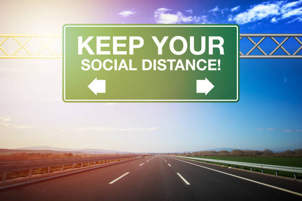 istock Keep Your Social Distance Road Sign 1219131483
