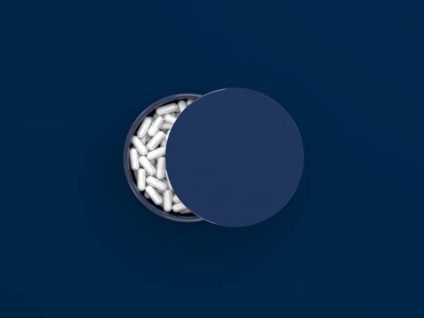 packing sleeping pills on a dark blue background. an ajar can with a sleeping pill forming a half moon shape in a top view. remedy for insomnia. creative concept. 3d render illustration. - narcotic medicine pill insomnia imagens e fotografias de stock