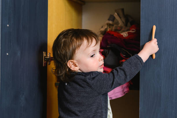 istock Baby girl open her closet 1219131940