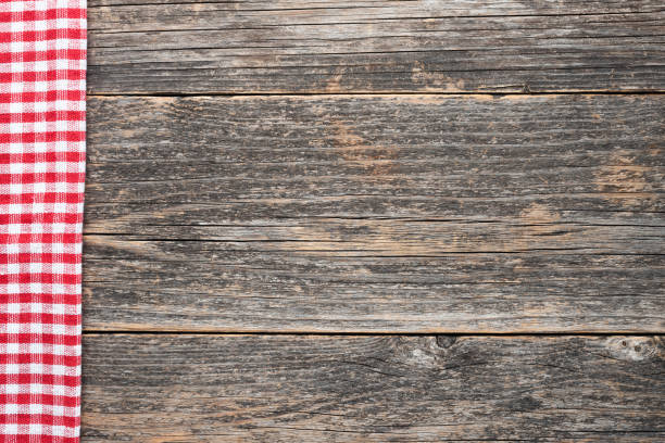 istock Wooden background with checkered textile 1219133483