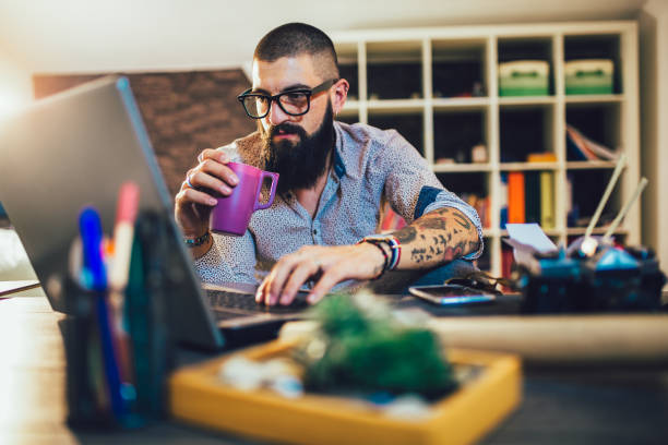 istock Young man working on his laptop computer at home 1219135374
