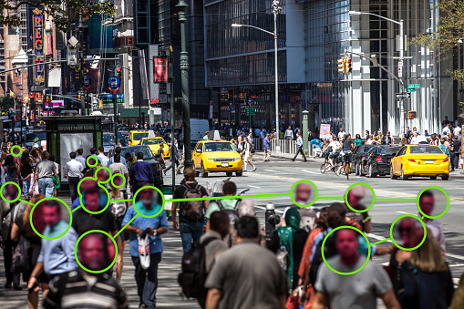 Facial Recognition technology used to prevent Covid-19 spread.

Note for inspectors: people is a crowd, cars are edited even if not necessary.