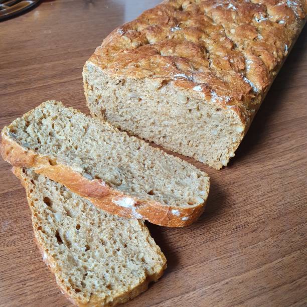 istock Homemade bread, two slices next to it. 1219137714