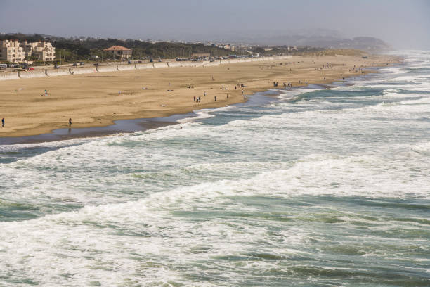 istock people enjoy the waves at Ocean Beach 1219137840