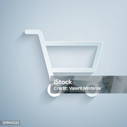 istock Paper cut Shopping cart icon isolated on grey background. Online buying concept. Delivery service sign. Supermarket basket symbol. Paper art style. Vector Illustration 1219141222