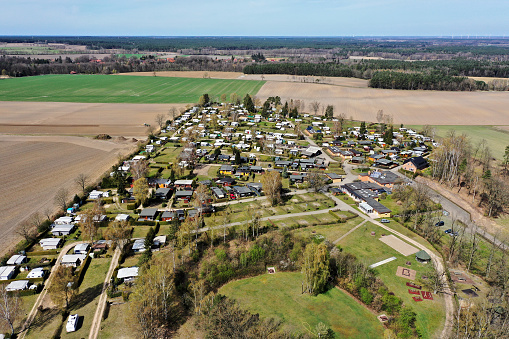 Overview of a large campsite between fields, meadows and arable land