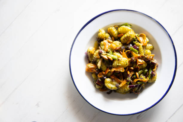 istock Gnocchis with vegetables and pesto 1219141802