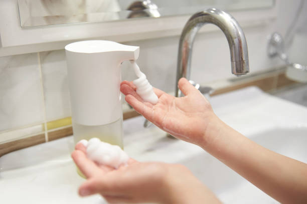 istock Soap dispenser and children hands 1219142479