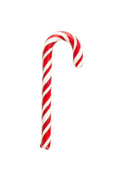 Holiday sweet candy in the form of a red-white striped stick of a cane, isolated