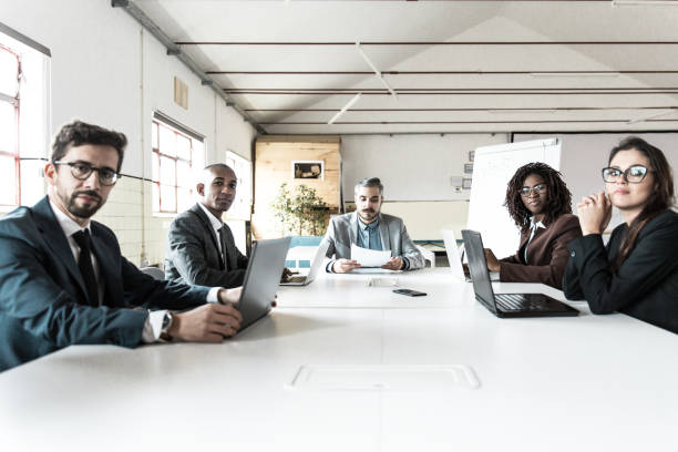 istock Group of serious managers during morning briefing 1219142544