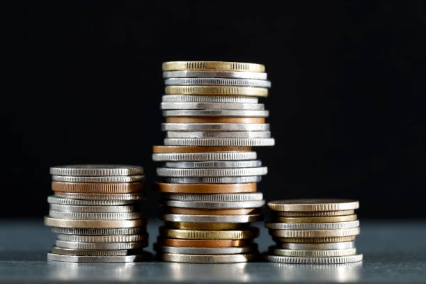 istock Three piles of coins 1219142722