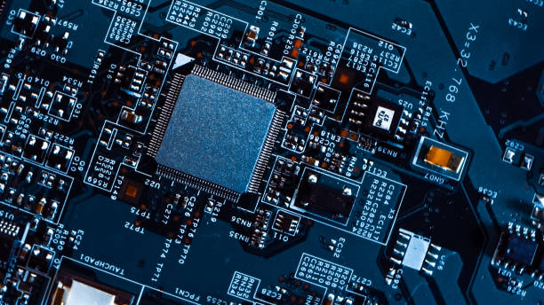 istock Macro Close-up Shot of Microchip, CPU Processor on Printed Circuit Board / Computer Motherboard with Components Inside of Electronic Device, Parts of Supercomputer. 1219143073