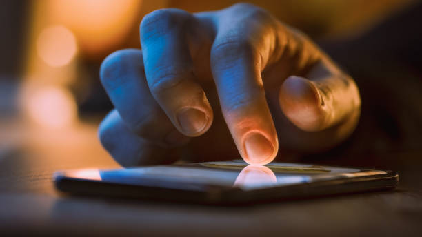istock Touch Screen Smartphone Lying on the Table while Person is Typing a Message. Concept of Email Writing, Chatting in Social Media Apps, Sending an SMS, Taking Note. Close-up Macro View 1219143081