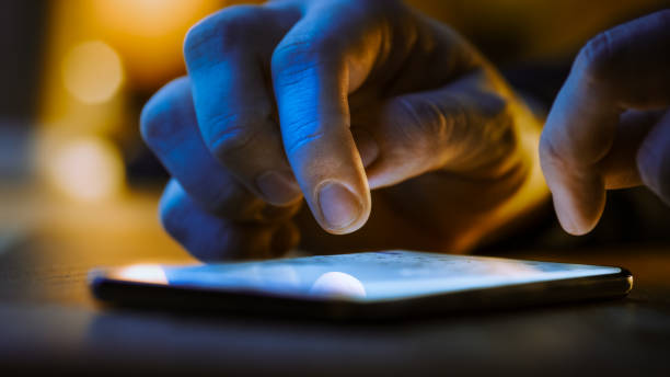 istock Touch Screen Smartphone Lying on the Table while Person is Typing a Message. Concept of Email Writing, Chatting in Social Media Apps, Sending an SMS, Taking Note. Close-up Macro View 1219143106