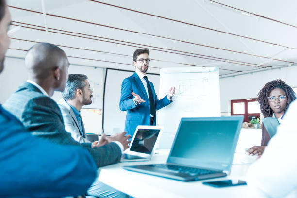 istock Low angle shot of speaker talking and looking at colleagues 1219143239