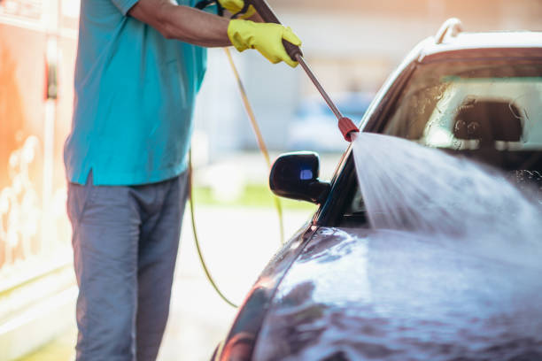 istock Car washing. Cleaning car using high pressure water. 1219144748