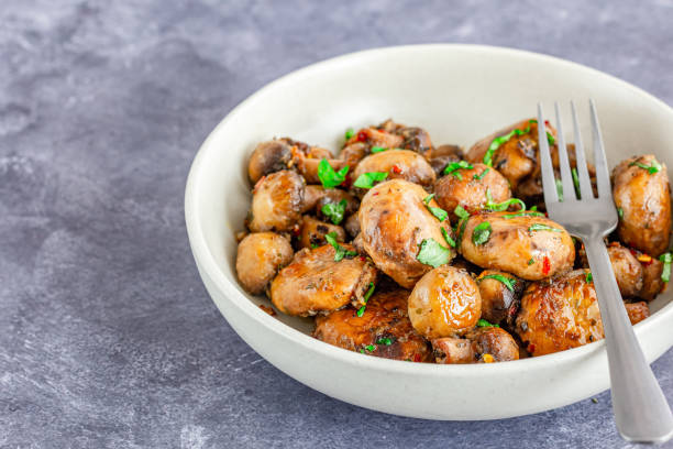 Sauteed Mushrooms with Garlic Butter Directly Above Close-Up Photo stock photo