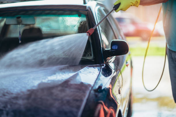 istock Car washing. Cleaning car using high pressure water. 1219146164