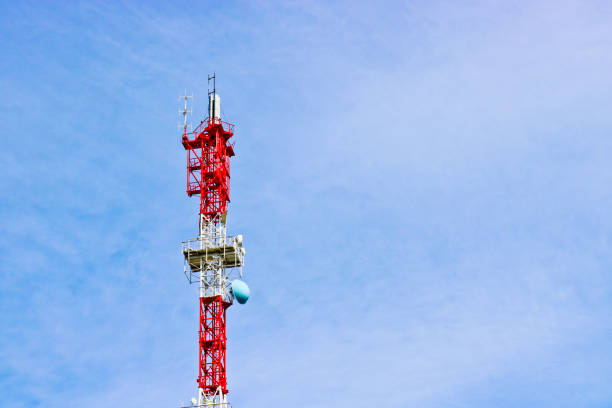 istock Cellular antenna and telecommunications against the blue sky. Copy space. 1219147363