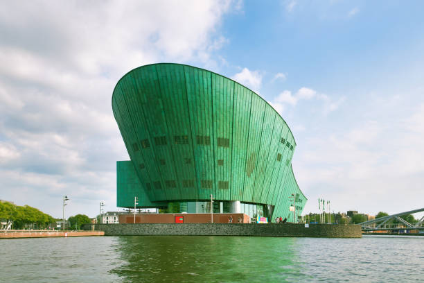 nemo science museum in amsterdam, netherlands viewed across the water - nemo museum imagens e fotografias de stock