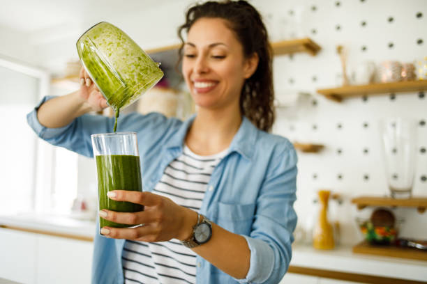 istock Preparing a green smoothie at home 1219147586