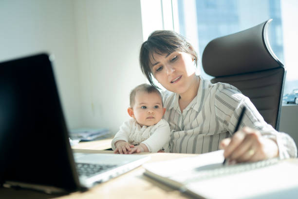 istock Mother with daughter working in office 1219148974
