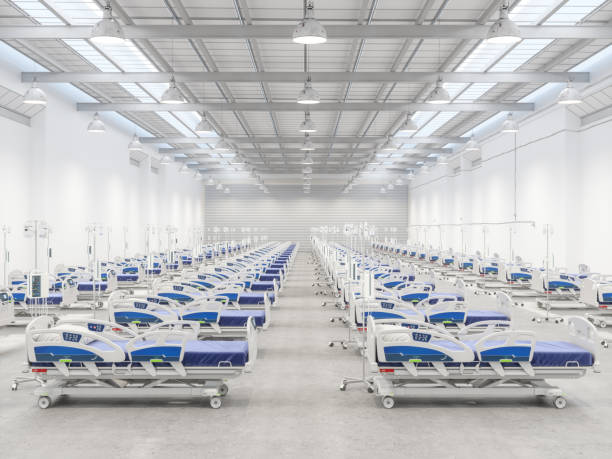 istock Empty Hospital Beds in a Warehouse 1219149637