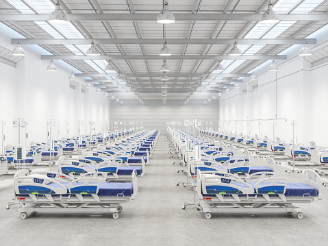 Empty Hospital Beds in a Warehouse