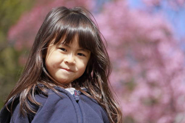 istock Japanese girl and cherry blossoms (5 years old) 1219151387