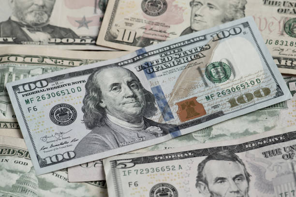 istock Different banknotes of american dollars 1219153449