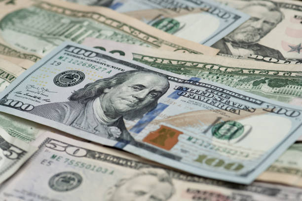 istock Different banknotes of american dollars 1219153546