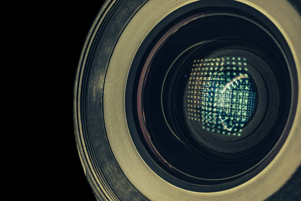 istock Beautiful camera lens with light reflection. Background pattern for design. Macro photography view. 1219154707