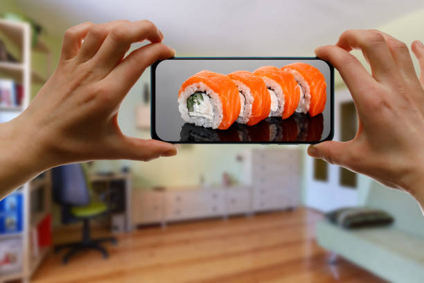 istock Order sushi set via the mobile app on your smartphone from home. 1219155718