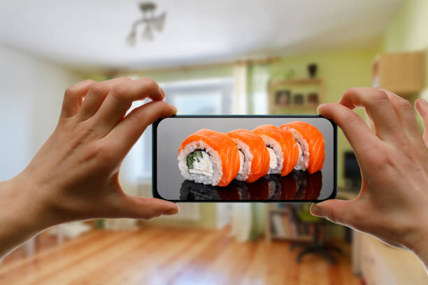 istock Order sushi set via the mobile app on your smartphone from home. 1219155733