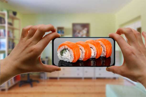 istock Order sushi set via the mobile app on your smartphone from home. 1219155740
