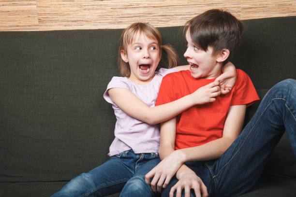 istock Siblings going mad locked in at home during self-isolation 1219156030