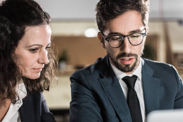 istock Focused business people working with laptop 1219157959