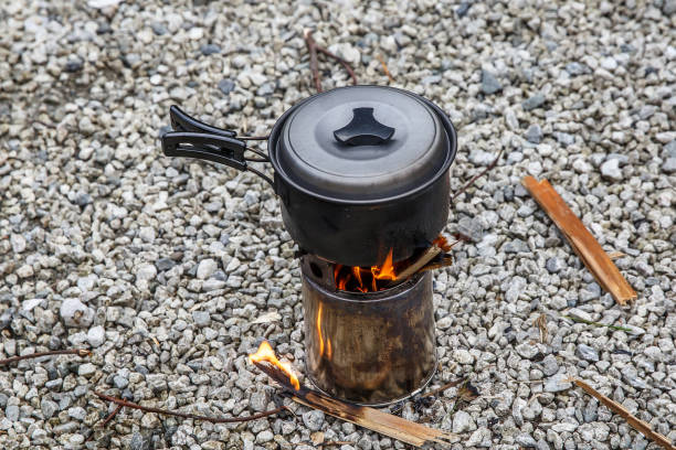 istock Cooking on a small camping stove in a mountain camp. 1219158149