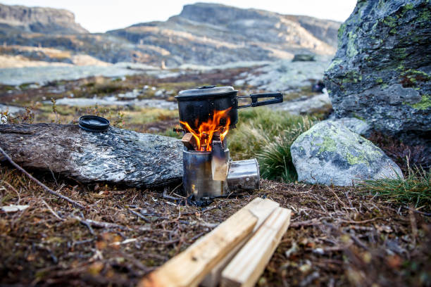 istock Cooking on a small camping stove in a mountain camp. 1219158228