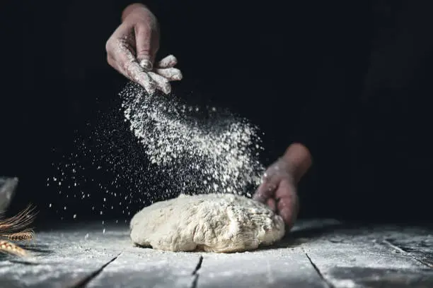 Photo of Kneading Bread Dough with Hands