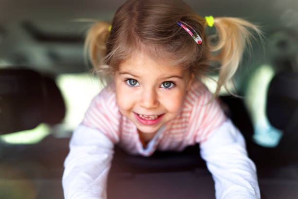 Little Girl Having Fun Inside Car.