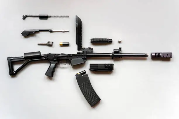 Disassembled machine gun Rifle boar. Details of firearms in a disassembled state. flat lay