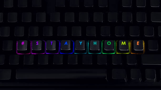 istock Stay home - Written on RGB backlit keyboard, closeup 1219161772