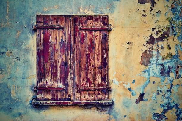 istock old wooden window shutters closeup 1219162113