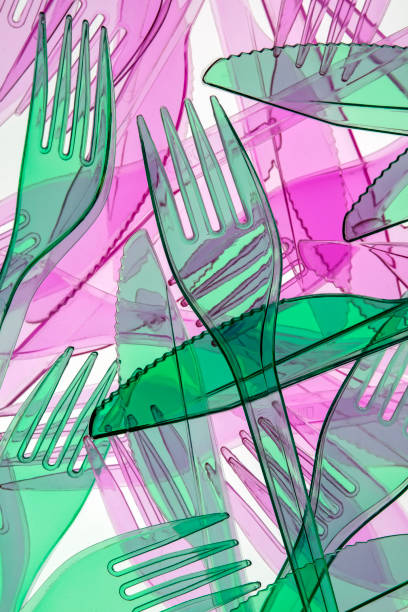 istock green and pink plastic cutlery 1219162126