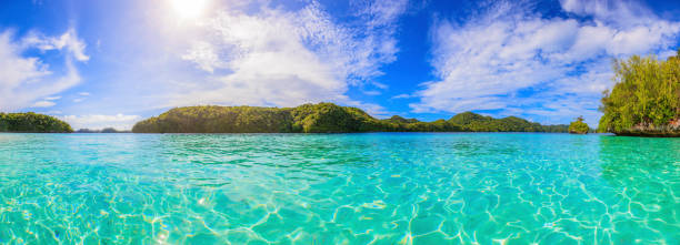 Turquoise waters between coral islands in Palau during daytime Turquoise waters between coral islands in Palau during daytime palau beach stock pictures, royalty-free photos & images