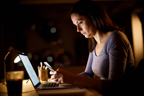 istock Mature woman working late 1219163544